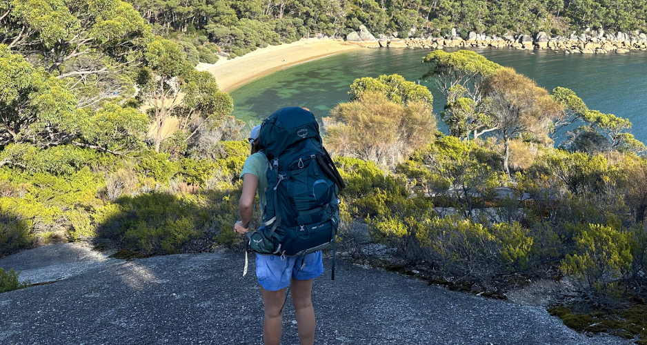 Adjusting Osprey Ariel Plus 70 on a hike in Wilsons Prom